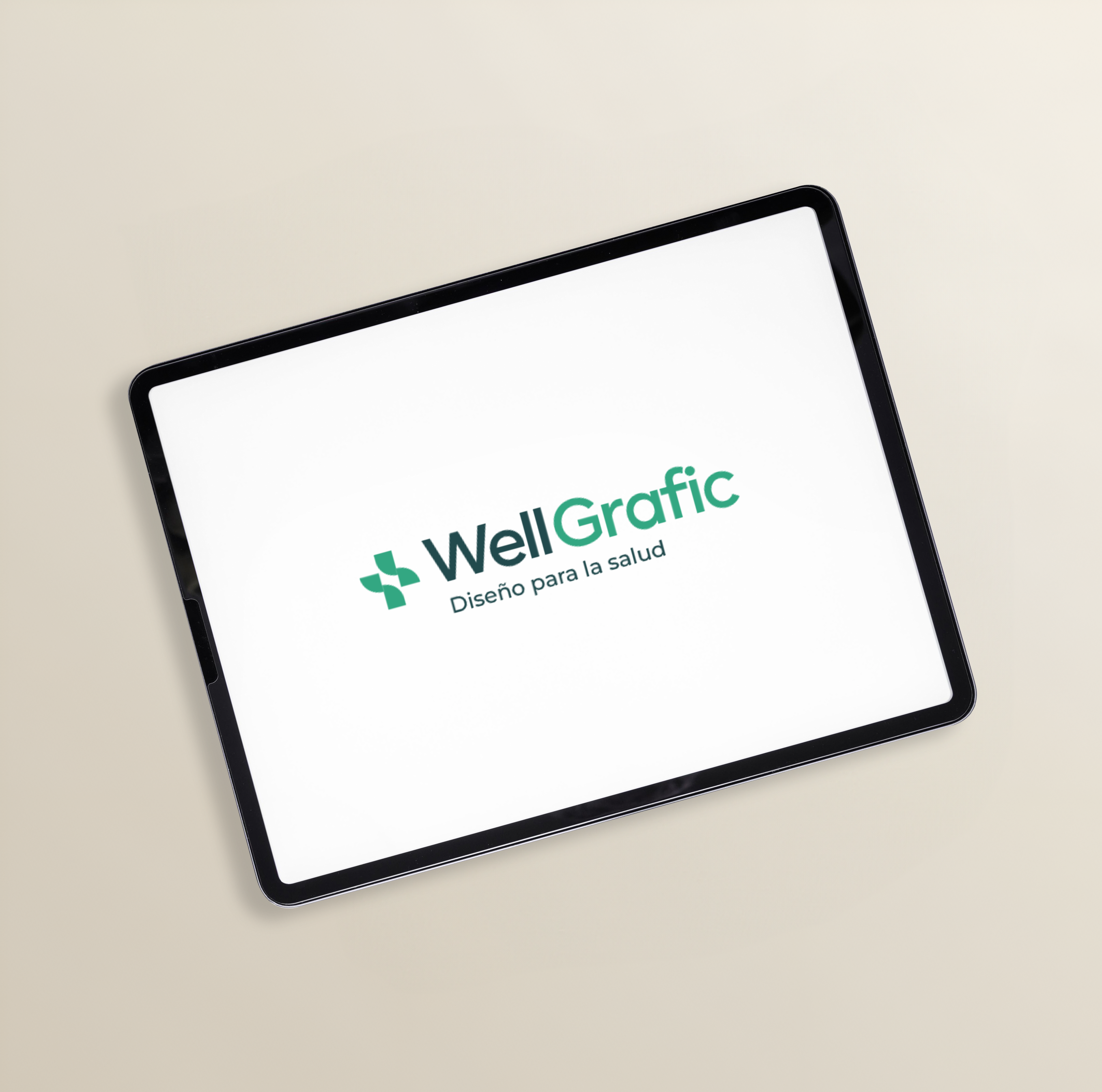 iPad con el logo de WellGrafic — Diseño para la salud